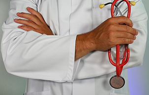 doctor crossing arms with stethoscope