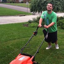 Matty W. cutting grass