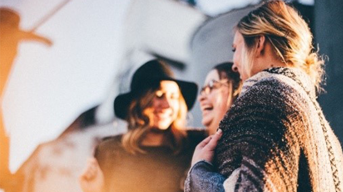 girls laughing during sunset