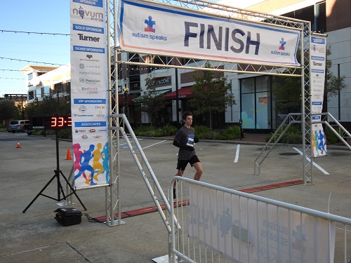 Houston 8K 2022 One Runner at Finish Line